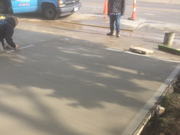 New concrete driveway installation by ODC Construction ODC Construction installs and repairs concrete driveways