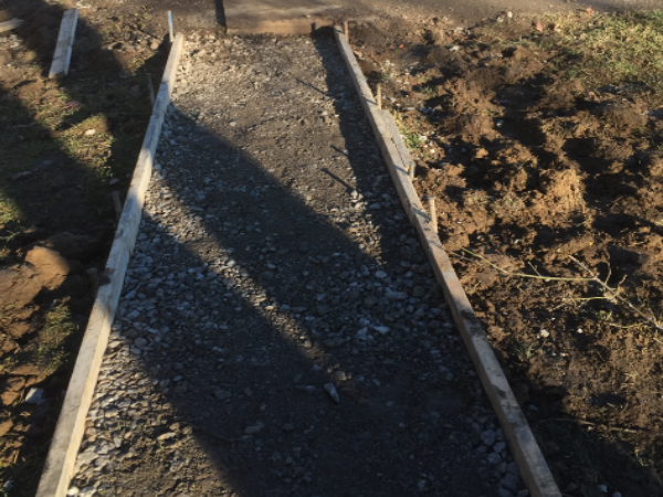 ODC Construction installs concrete pathway Concrete sidewalk installation for mobile home by ODC Construction