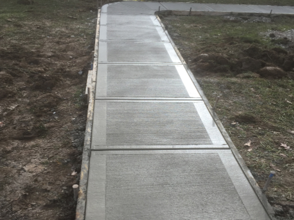 ODC Construction installs concrete pathway New concrete sidewalk pathway for mobile home by ODC Construction
